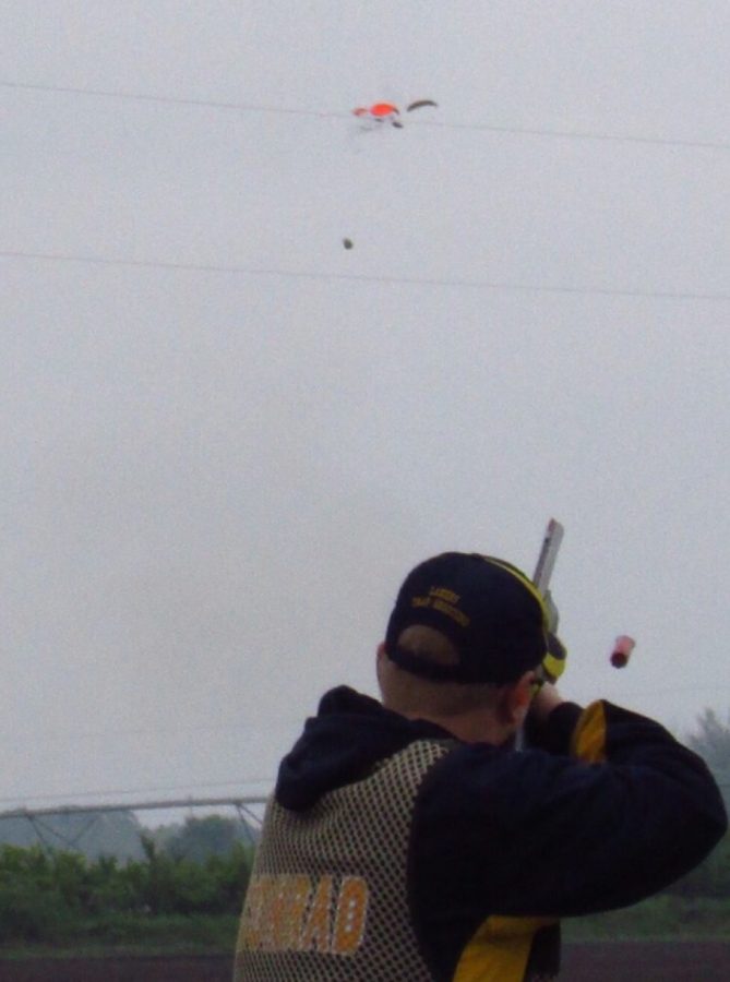 Prior Lake Trap Shooting Captain, Blake Conrad hitting a target. 