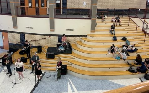 Learning stairs being used to feature student rock bands and for lounging during Laker Time