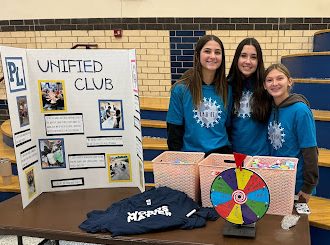 Unified Club members promoting the Unified FACS and PE classes during lunch (photo taken by Ms. Running)