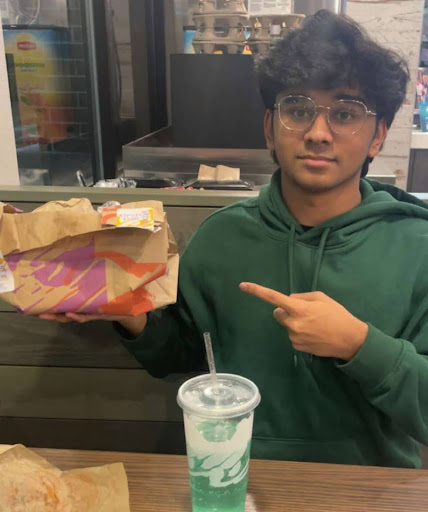 Eshaan at Taco Bell eating his favorite meal