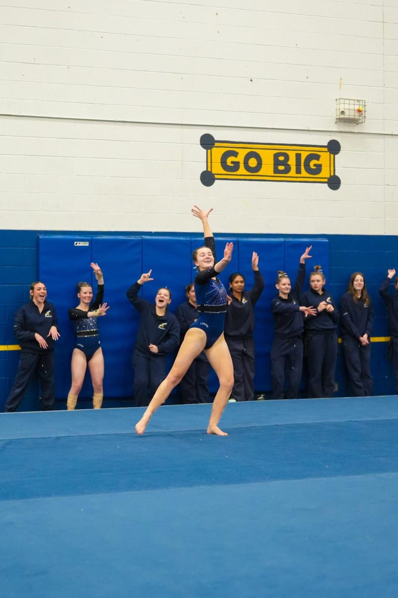 PL Gymnasts support Madeline Chappuis on her floor routine