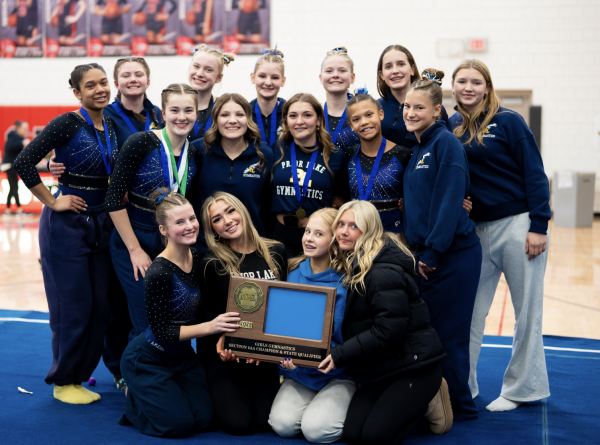 Prior Lake Gymnastics team with their Section 2AA Championship trophy